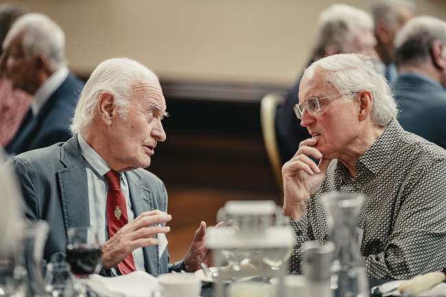 People chatting at a meeting